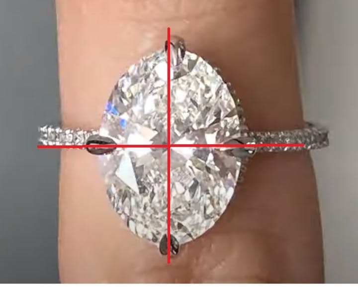 Misaligned oval diamond with prongs