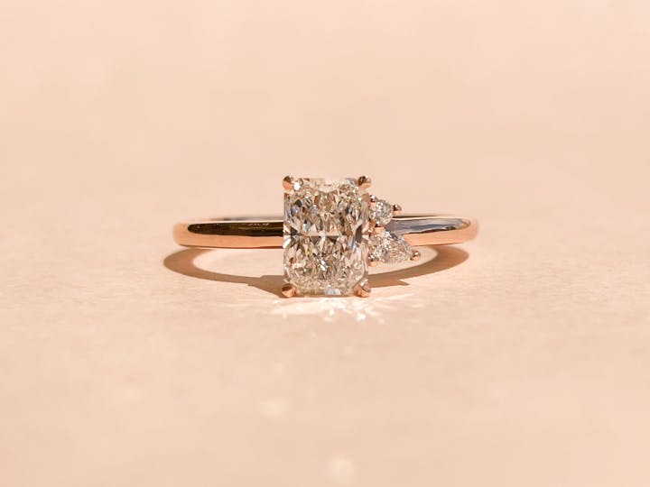 Asymmetrical 3 Stone Radiant Diamond Engagement Ring