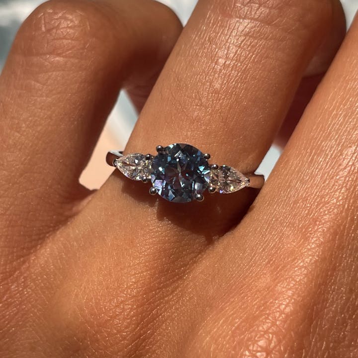 3 stone ring with deep blue sapphire.jpg