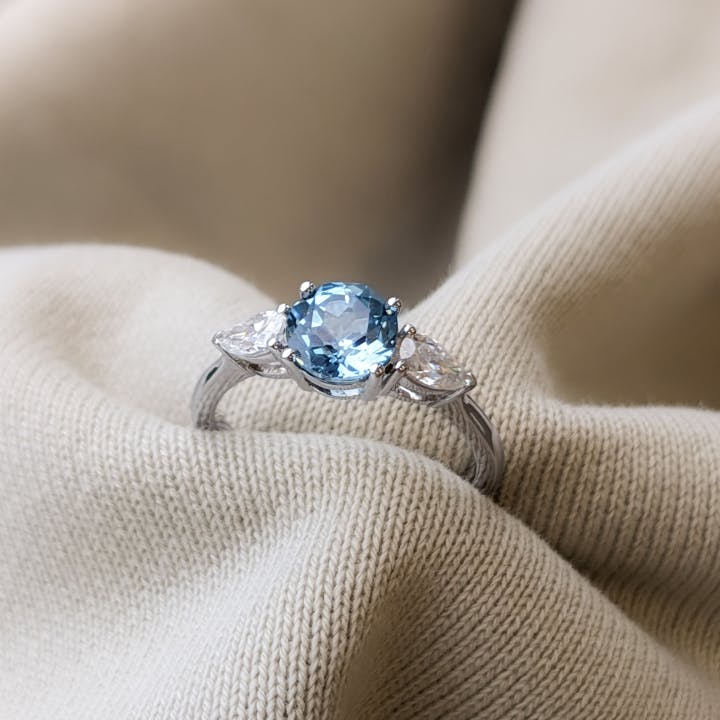 Symmetrical Light Blue 3 Stone Sapphire Engagement Ring
