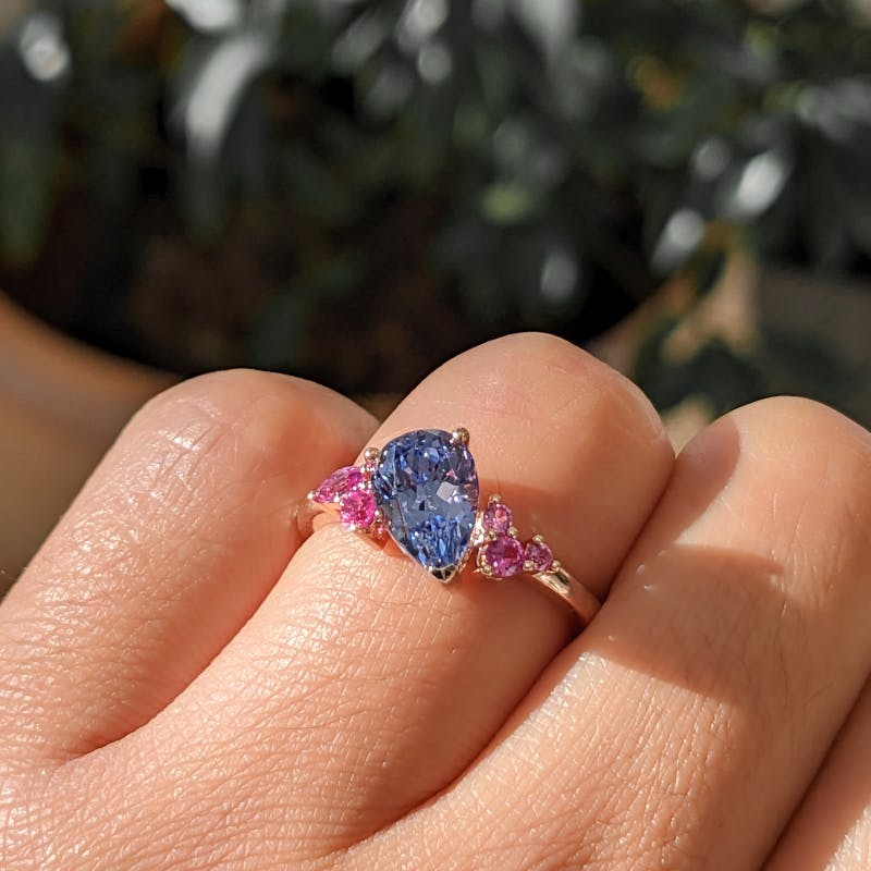 Asymmetrical Cornflower Blue Sapphire with Accenting Pink Sapphires
