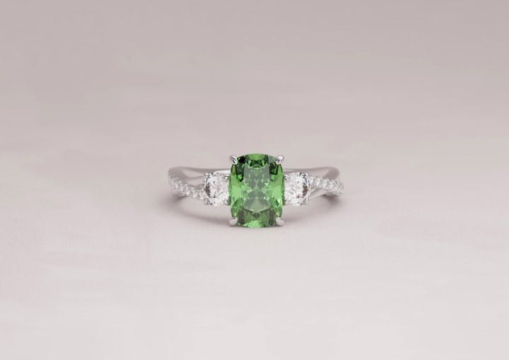 Three Stone Triology Engagement Ring with Green Diamond Cushion Centre