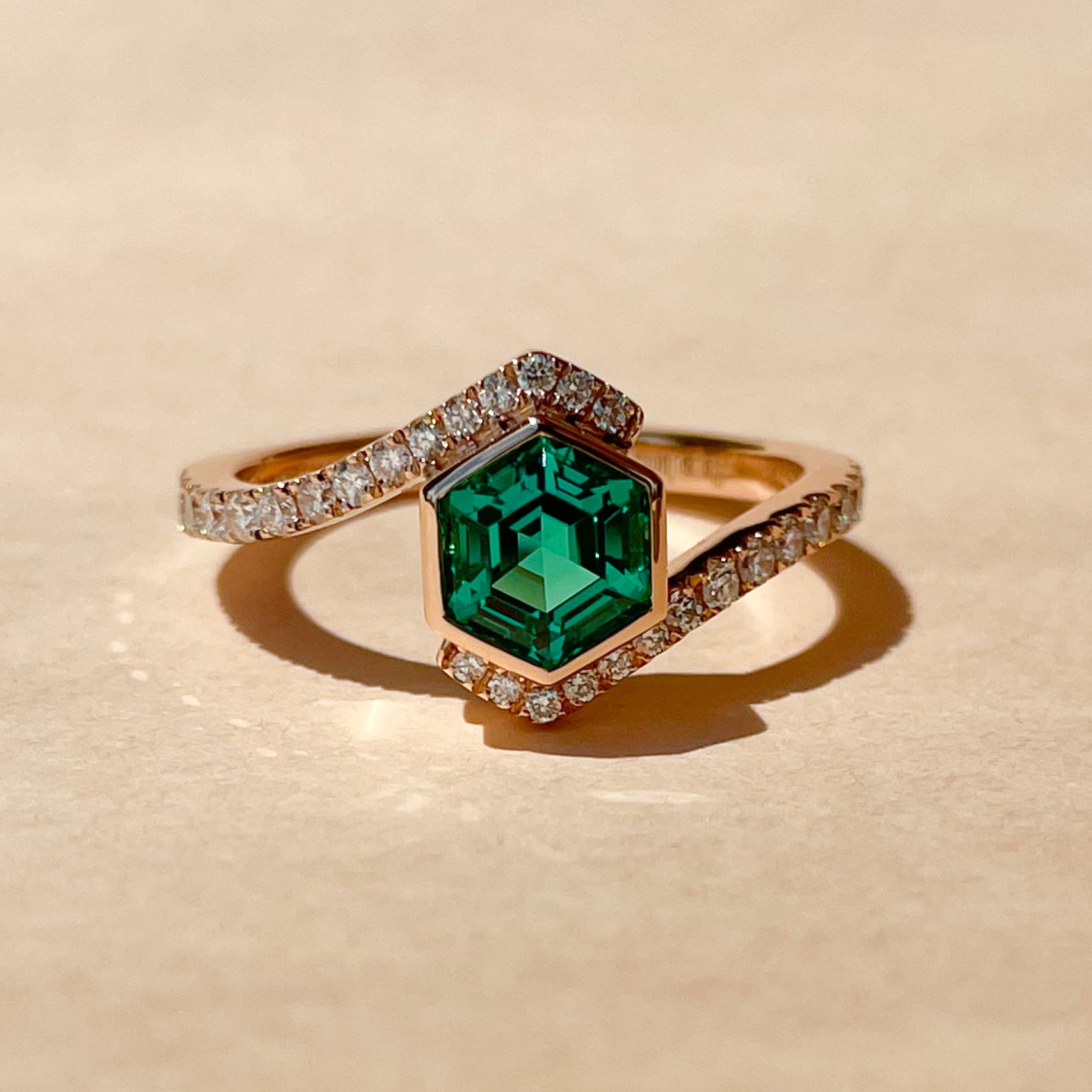 Hexagonal cut emerald with diamonds on rose gold