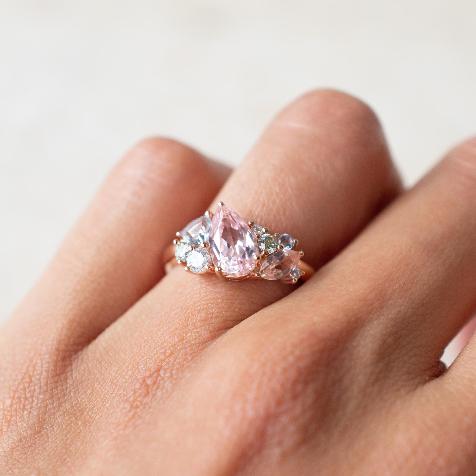 Multi-stone engagement ring featuring pears, marquise and round diamonds